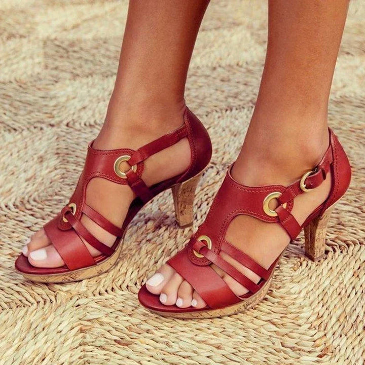SANDAL WITH CUT-OUTS AND DECORATIVE DETAILS